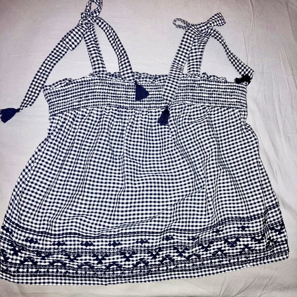 B/W gingham,  tassle-tie shoulders, embroidered hem, flowy smocked top. Small